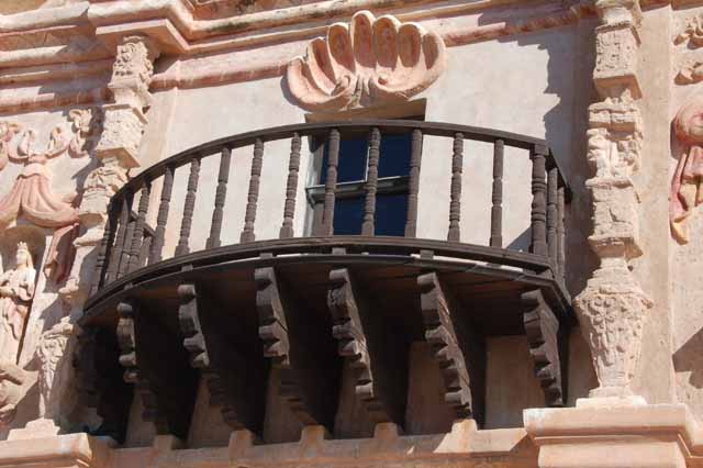 a balcony on the facade of Mission San Xavier